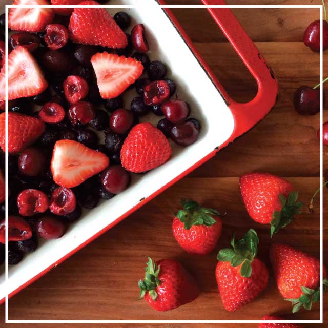 tray of fresh red mixed berries